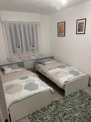 Un ou plusieurs lits dans un hébergement de l'établissement Appartement T3