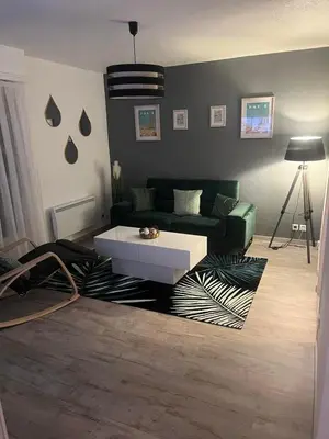 Un ou plusieurs lits dans un hébergement de l'établissement Appartement T3