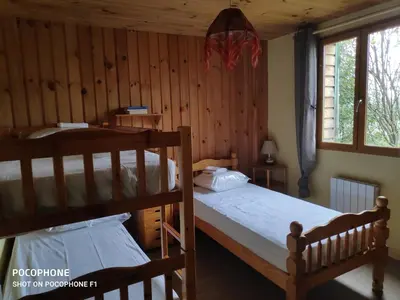 Un ou plusieurs lits dans un hébergement de l'établissement Hautes Vosges Chalet Pâquerette