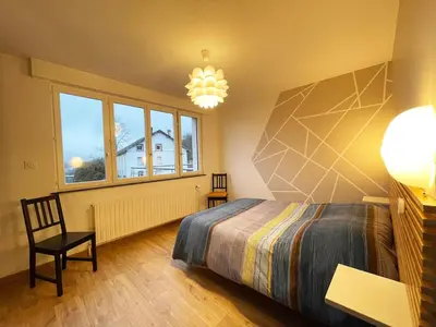 Un ou plusieurs lits dans un hébergement de l'établissement appartement cosy
