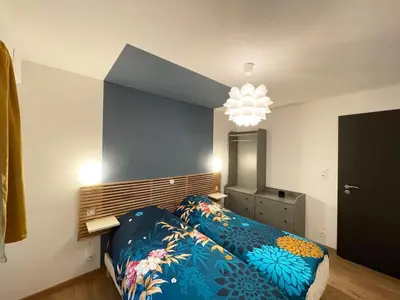 Un ou plusieurs lits dans un hébergement de l'établissement appartement cosy