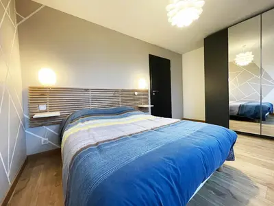Un ou plusieurs lits dans un hébergement de l'établissement appartement cosy