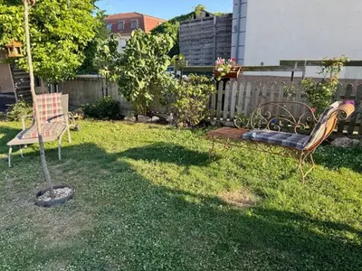 Jardin de l'établissement Appartement moderne, neuf et tout confort