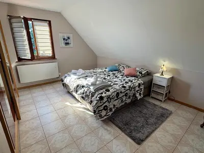 Un ou plusieurs lits dans un hébergement de l'établissement Maison familiale, authentique, confort et calme