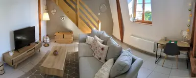 Coin salon dans l'établissement Les Toits de Mittelwihr proche Colmar, Ribeauvillé