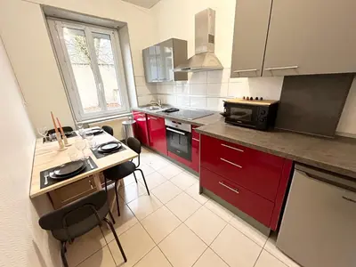 Cuisine ou kitchenette dans l'établissement Magnifique appartement proche gare