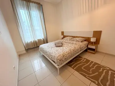Un ou plusieurs lits dans un hébergement de l'établissement Magnifique appartement proche gare