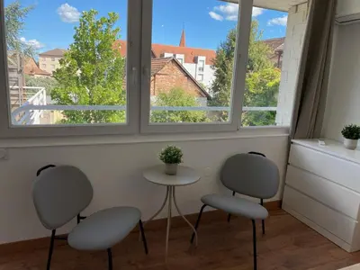 Coin salon dans l'établissement Studio climatisé 30 m2 à 2 min de Colmar