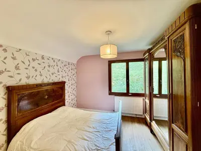 Un ou plusieurs lits dans un hébergement de l'établissement La Ferme du Pré Toussaint - Spacieux gîte au calme