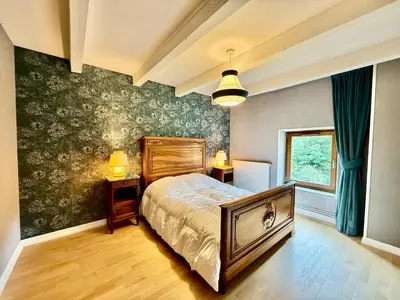 Un ou plusieurs lits dans un hébergement de l'établissement La Ferme du Pré Toussaint - Spacieux gîte au calme