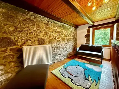 Coin salon dans l'établissement La Ferme du Pré Toussaint - Spacieux gîte au calme