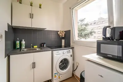 Cuisine ou kitchenette dans l'établissement Proche centre et calme - cozy - parking privé en résidence