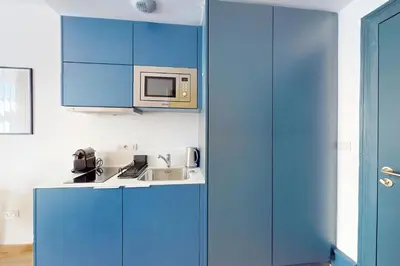 Cuisine ou kitchenette dans l'établissement Résidence CoLiving Porte de France - Self Check In by Homenhancement