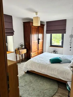 Un ou plusieurs lits dans un hébergement de l'établissement Maison en lisière de forêt, montagne et vignobles
