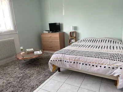 Un ou plusieurs lits dans un hébergement de l'établissement Petit appartement cosy