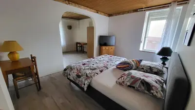 Un ou plusieurs lits dans un hébergement de l'établissement Suite Cosy Deluxe 
