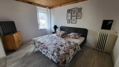 Un ou plusieurs lits dans un hébergement de l'établissement Suite Cosy Deluxe 