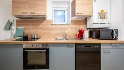 Cuisine ou kitchenette dans l'établissement BEAUSÉJOUR Appart - HYPER CENTRE VILLE