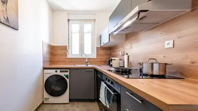 Cuisine ou kitchenette dans l'établissement Appart Cocooning 6 Personnes Hyper Centre Mulhouse