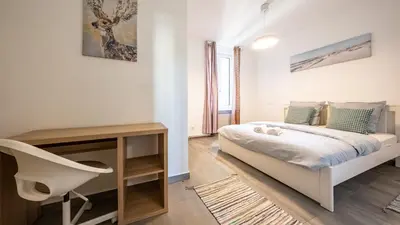 Un ou plusieurs lits dans un hébergement de l'établissement Appart Cocooning 6 Personnes Hyper Centre Mulhouse