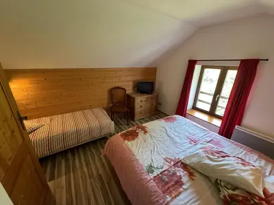 Un ou plusieurs lits dans un hébergement de l'établissement Domaine de la prairie des prés