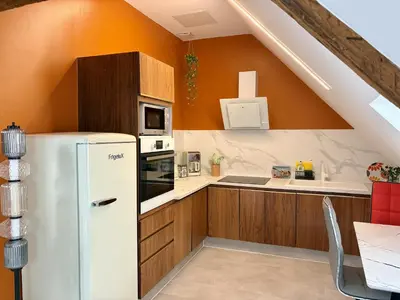 Cuisine ou kitchenette dans l'établissement Appart Saint Jo