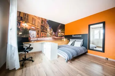 Un ou plusieurs lits dans un hébergement de l'établissement Sleep in Alsace - Balcon - Centre