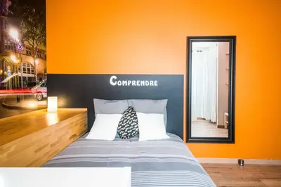 Un ou plusieurs lits dans un hébergement de l'établissement Sleep in Alsace - Balcon - Centre