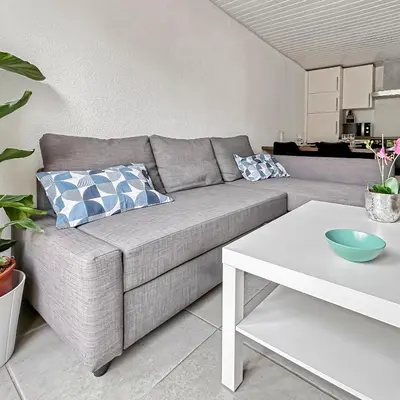 Coin salon dans l'établissement Parking privé & terrasse ensoleillée