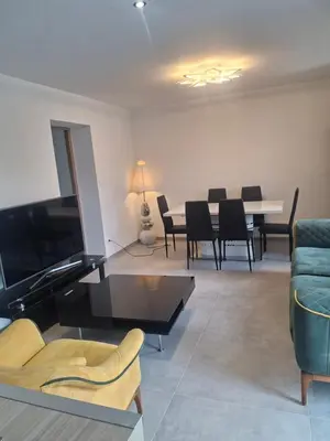 Coin salon dans l'établissement Appartement T3 neuf