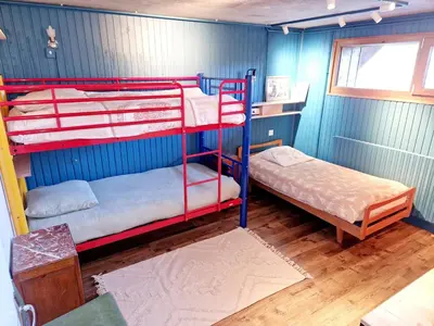 Un ou plusieurs lits dans un hébergement de l'établissement Vosges, quiet four bedroom chalet, cinema, games room