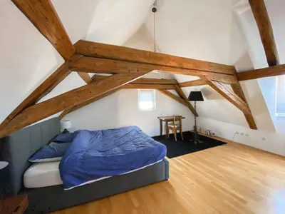 Un ou plusieurs lits dans un hébergement de l'établissement Colmar Attic Duplex