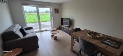 Télévision ou salle de divertissement dans l'établissement CHEZ GERALDINE GITES à LA FERME