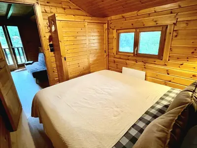 Un ou plusieurs lits dans un hébergement de l'établissement Chalet du Grand Arbre