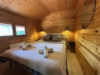 Un ou plusieurs lits dans un hébergement de l'établissement Chalet du Grand Arbre
