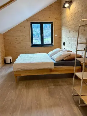 Un ou plusieurs lits dans un hébergement de l'établissement Chalet Muguet, spa privatif, 4p