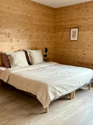 Un ou plusieurs lits dans un hébergement de l'établissement Chalet Lilas, spa privatif, 2p