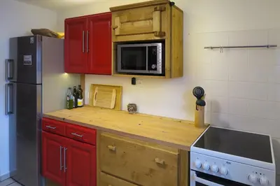 Cuisine ou kitchenette dans l'établissement Appartement Le Coeur des Vosges - 2 chambres
