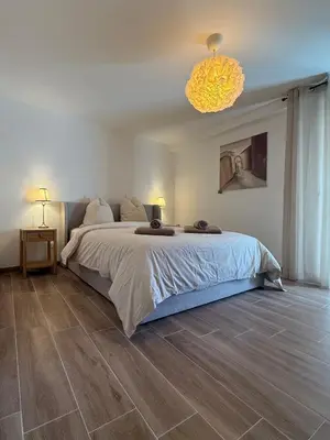 Un ou plusieurs lits dans un hébergement de l'établissement Maison Bleue, Appartements Thann centre, proche vignoble, terrasse avec vue