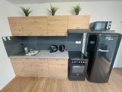 Cuisine ou kitchenette dans l'établissement Cosy 1 - Audincourt centre