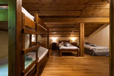 Un ou plusieurs lits dans un hébergement de l'établissement Chalet Les Lucioles, La Bresse 14p - SPA