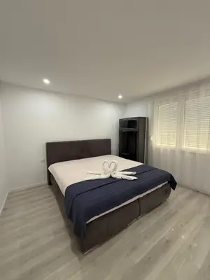 Un ou plusieurs lits dans un hébergement de l'établissement Appartement Lumière