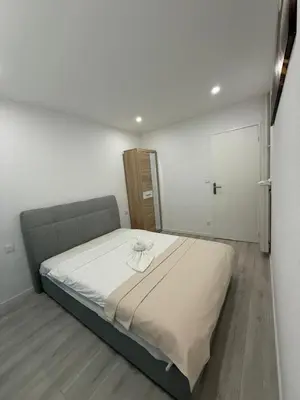 Un ou plusieurs lits dans un hébergement de l'établissement Appartement Lumière