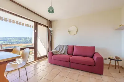 Coin salon dans l'établissement Le Cocon du Chaud Costet - Avec balcon