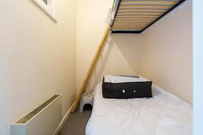 Un ou plusieurs lits dans un hébergement de l'établissement Le Cocon du Chaud Costet - Avec balcon