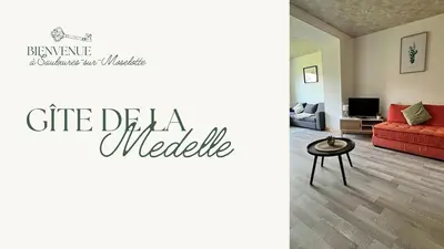 Coin salon dans l'établissement Duplex- La Medelle