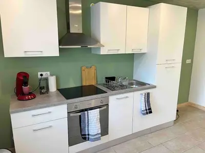 Cuisine ou kitchenette dans l'établissement Duplex- La Medelle