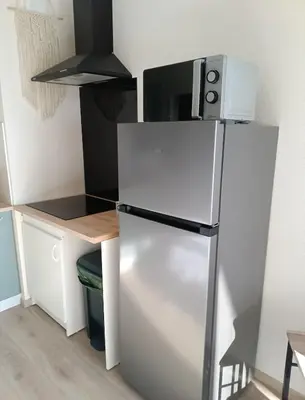 Cuisine ou kitchenette dans l'établissement La Parenthèse Divine Studio avec balcon Mulhouse