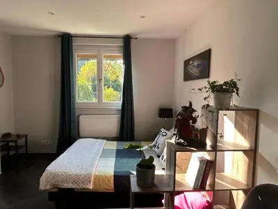 Un ou plusieurs lits dans un hébergement de l'établissement Colmar joli petit appartement