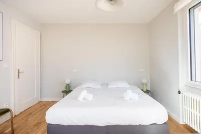 Un ou plusieurs lits dans un hébergement de l'établissement Le Majestic - Spacieux - Moderne - Proche centre - Terrasse